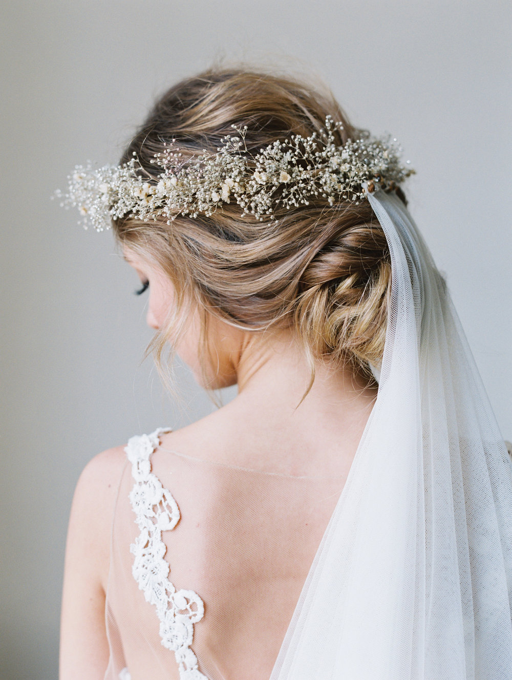 Trending Bridal Bun Hairstyle With Flowers For Wedding